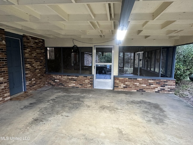 view of patio featuring a sunroom