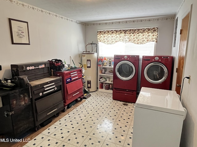 washroom featuring electric water heater and washing machine and clothes dryer