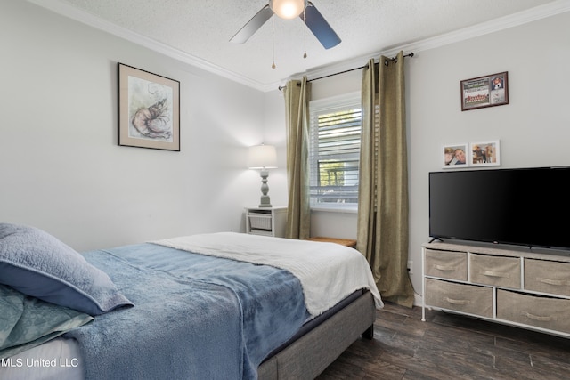 bedroom with ornamental molding, dark wood-type flooring, a textured ceiling, and ceiling fan