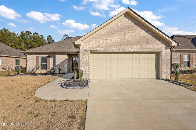 view of front facade with a garage and a front yard