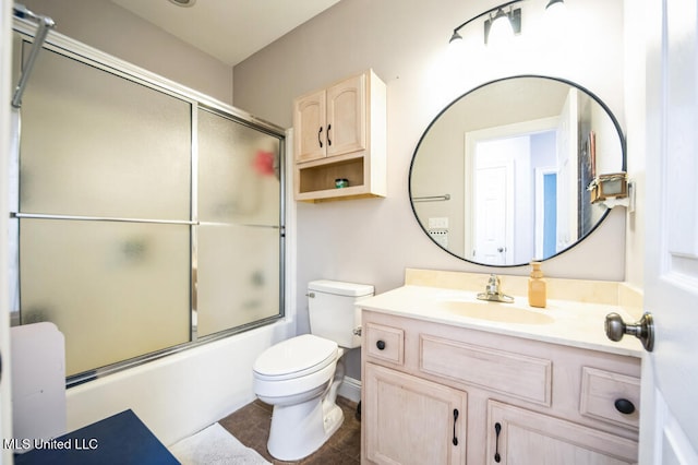10053 Kingston Rd, Bay Saint Louis, MS 39520 - bathroom with vanity, toilet, enclosed tub / shower combo, and tile patterned flooring