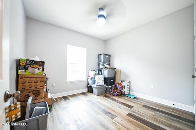 10053 Kingston Rd, Bay Saint Louis, MS 39520 - miscellaneous room with baseboards, wood finished floors, and a ceiling fan