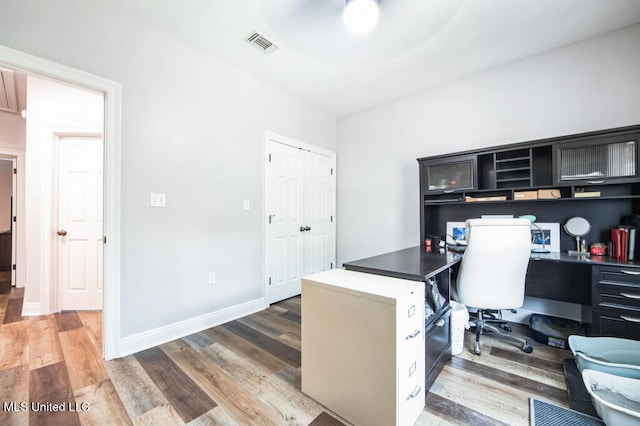 10053 Kingston Rd, Bay Saint Louis, MS 39520 - office space with built in study area, wood finished floors, and baseboards