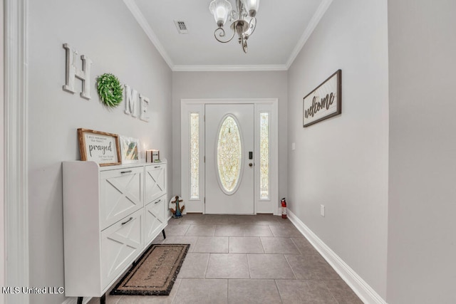 10053 Kingston Rd, Bay Saint Louis, MS 39520 - entryway with a chandelier, ornamental molding, tile patterned floors, and baseboards