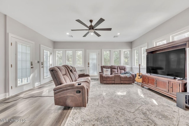 10053 Kingston Rd, Bay Saint Louis, MS 39520 - living area featuring ceiling fan, recessed lighting, light wood-style flooring, and baseboards