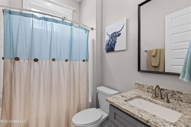 full bathroom with vanity and toilet