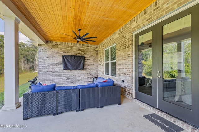 view of patio featuring an outdoor living space, a ceiling fan, and french doors