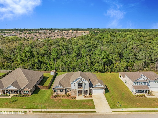 bird's eye view featuring a wooded view