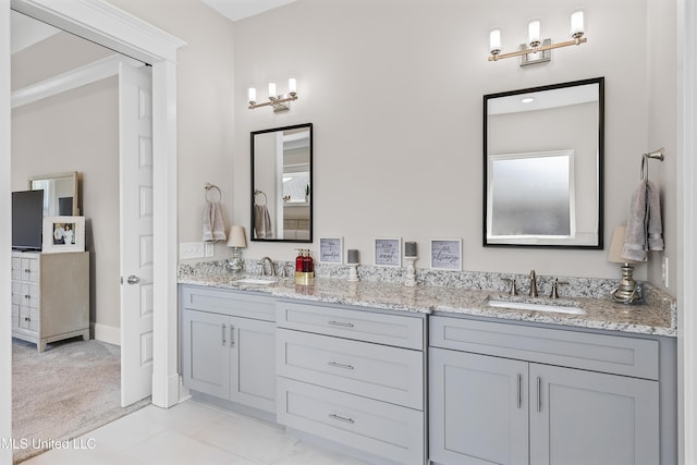 full bathroom featuring double vanity and a sink