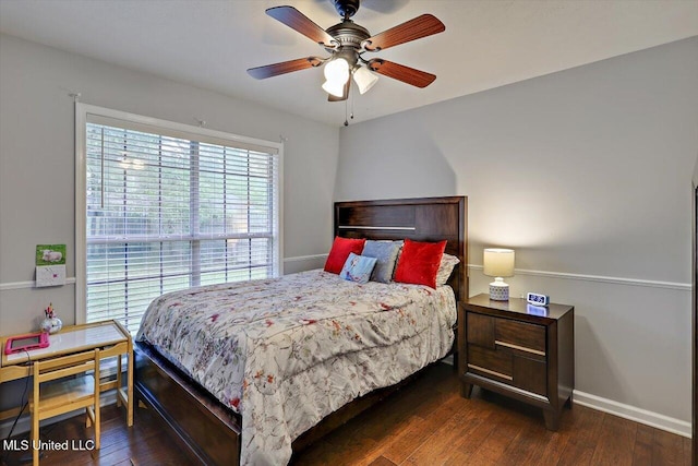 bedroom with baseboards, ceiling fan, and wood-type flooring