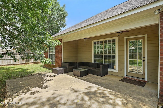 view of patio / terrace with ceiling fan, fence, and an outdoor hangout area