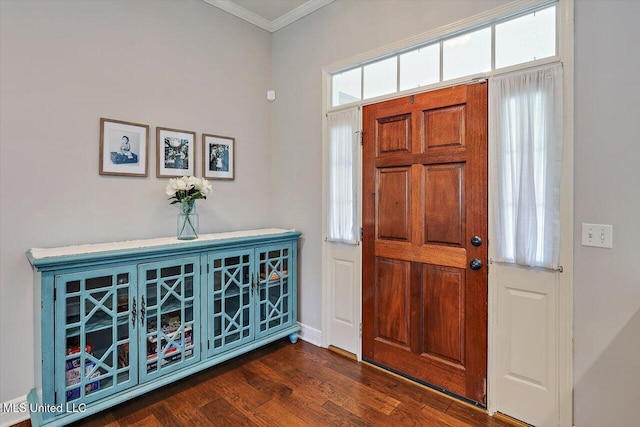 foyer entrance with baseboards, ornamental molding, and dark wood-style flooring