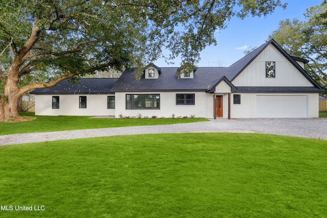 view of front facade featuring a garage and a front lawn