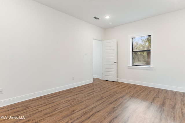 empty room featuring wood-type flooring