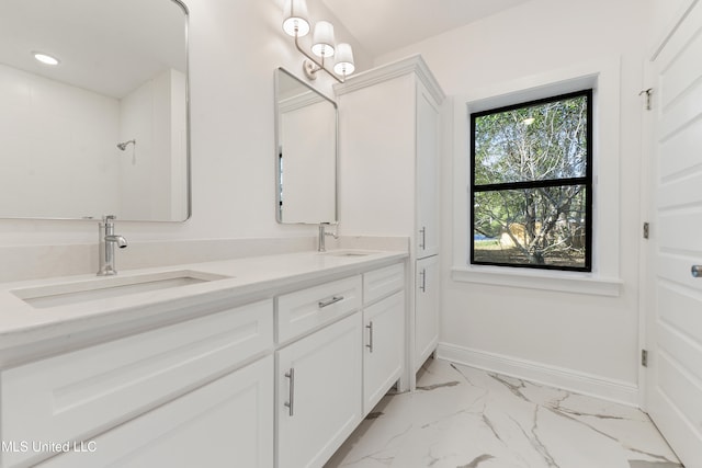 bathroom with walk in shower and vanity