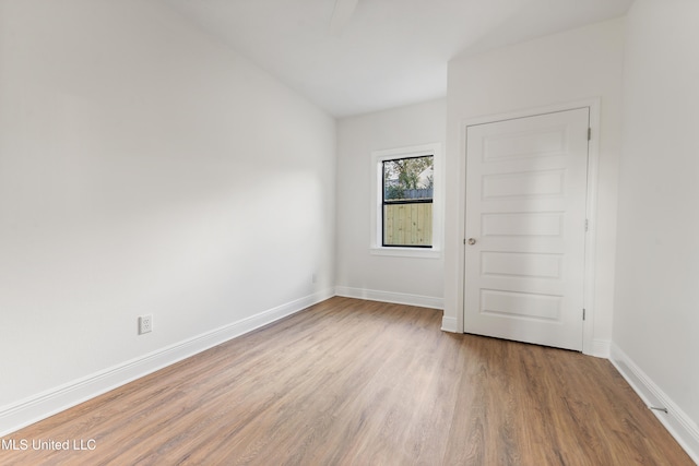 unfurnished room with light hardwood / wood-style flooring