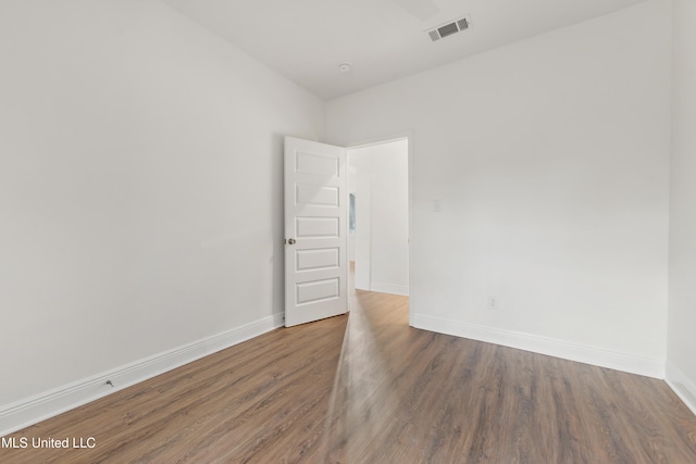 empty room with wood-type flooring