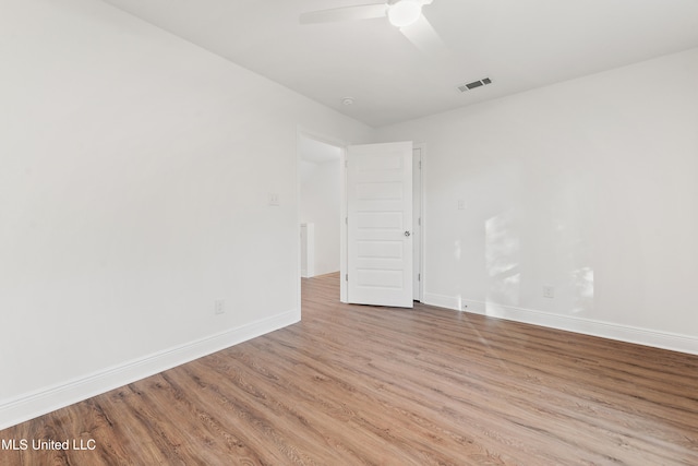 spare room featuring ceiling fan and light hardwood / wood-style flooring