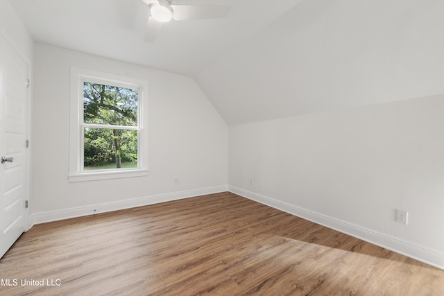 additional living space featuring ceiling fan, vaulted ceiling, and light hardwood / wood-style floors