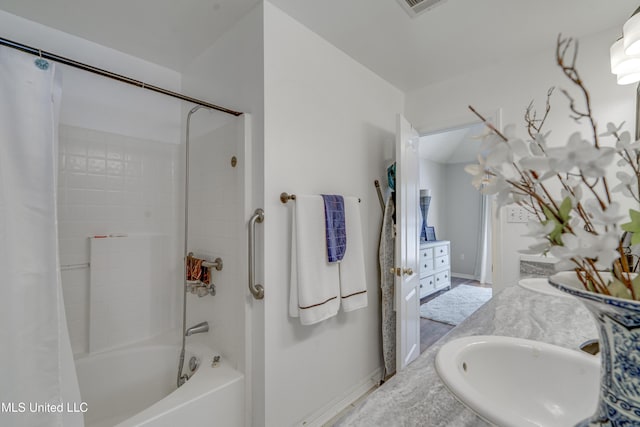 bathroom with shower / tub combo with curtain and vanity