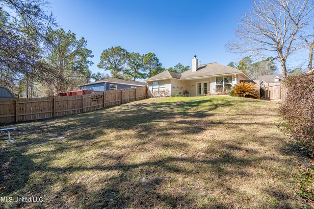 view of yard featuring a fenced backyard