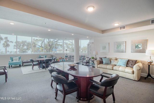 carpeted dining room with plenty of natural light