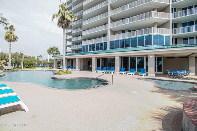 view of swimming pool featuring a patio