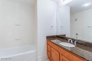 full bathroom featuring vanity