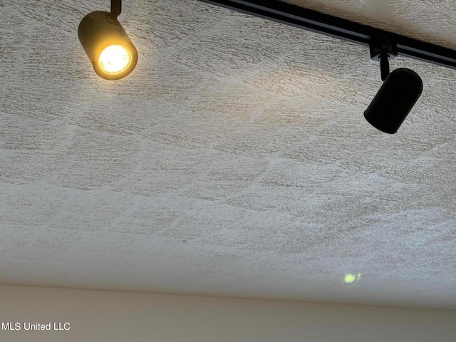 details with a textured ceiling