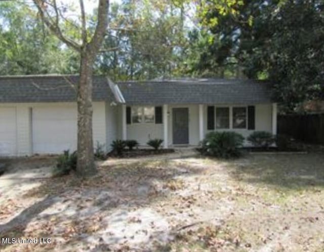 ranch-style house featuring a garage