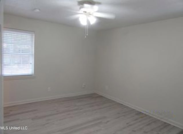 spare room featuring light wood-type flooring