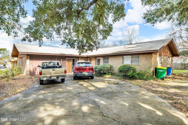 ranch-style house featuring a garage