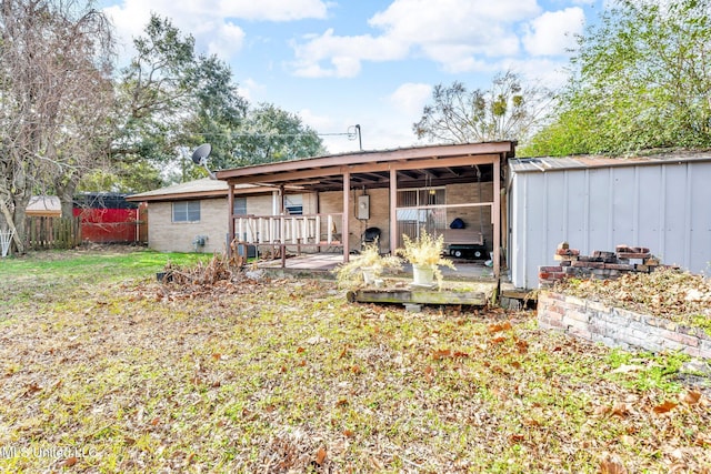 rear view of house with a lawn