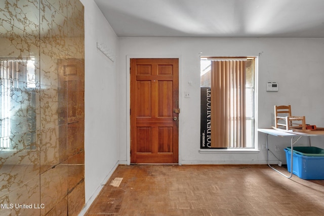 foyer with parquet flooring