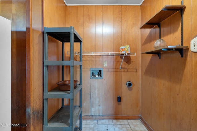 laundry area featuring electric dryer hookup, hookup for a washing machine, and wooden walls