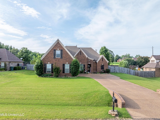 1668 Farindale Cv, Nesbit, MS 38651 - view of front facade featuring brick siding and concrete driveway