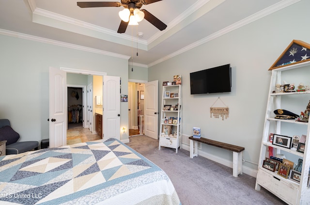 1668 Farindale Cv, Nesbit, MS 38651 - carpeted bedroom featuring a raised ceiling, ornamental molding, ensuite bath, and a ceiling fan