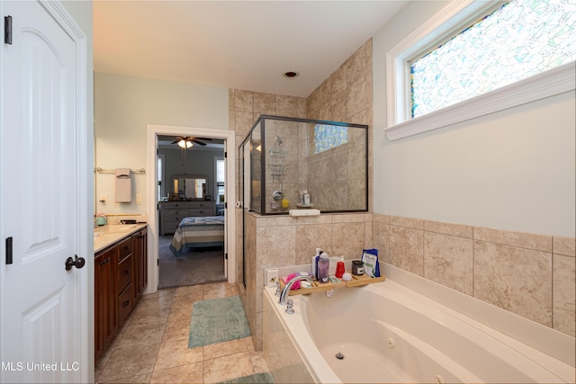 1668 Farindale Cv, Nesbit, MS 38651 - bathroom featuring a tub with jets, a stall shower, ensuite bath, vanity, and ceiling fan