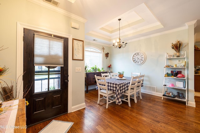 1668 Farindale Cv, Nesbit, MS 38651 - dining area with dark wood-style flooring, ornamental molding, a chandelier, and a raised ceiling