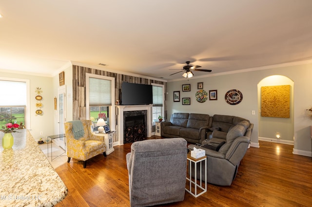 1668 Farindale Cv, Nesbit, MS 38651 - living area with plenty of natural light, ornamental molding, wood finished floors, a fireplace, and ceiling fan