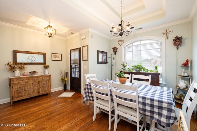 1668 Farindale Cv, Nesbit, MS 38651 - dining space featuring a chandelier, wood finished floors, a raised ceiling, and ornamental molding