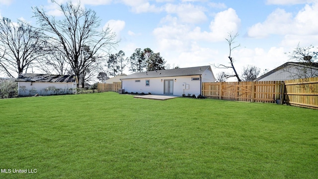 view of yard with a patio area and a fenced backyard