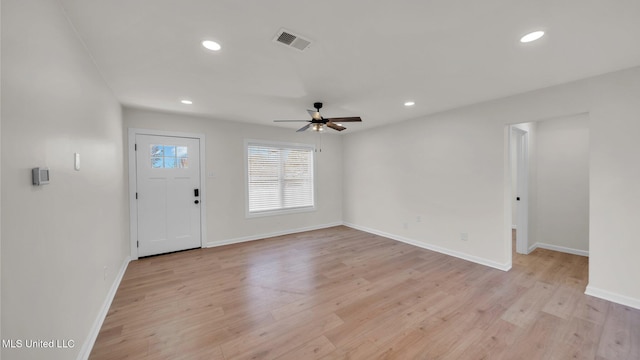 foyer entrance with light wood-style flooring, visible vents, and recessed lighting