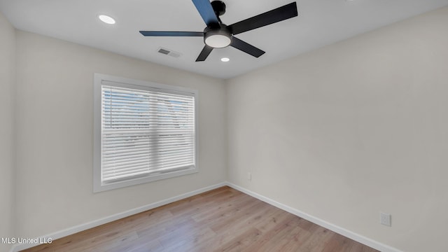 unfurnished room with recessed lighting, visible vents, light wood-style floors, a ceiling fan, and baseboards