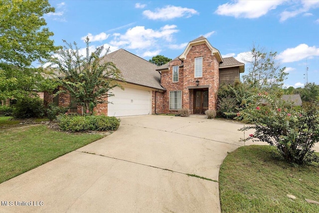 front of property with a garage and a front yard