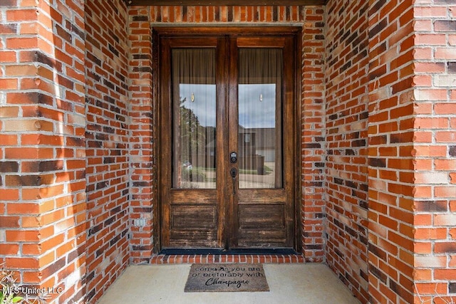 property entrance featuring french doors