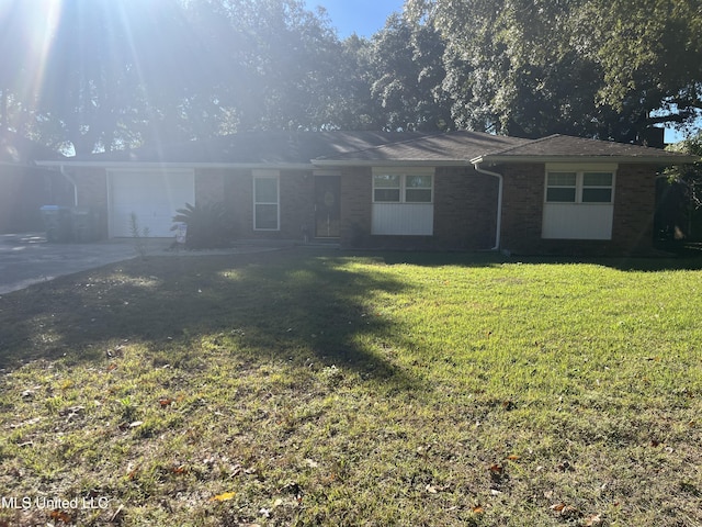 single story home with a front lawn and a garage