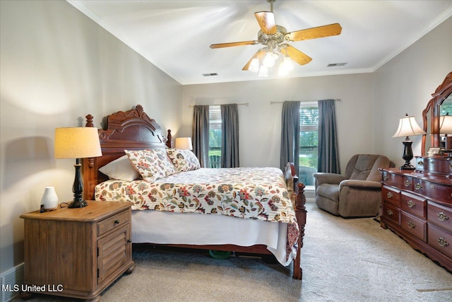 carpeted bedroom featuring ornamental molding and ceiling fan