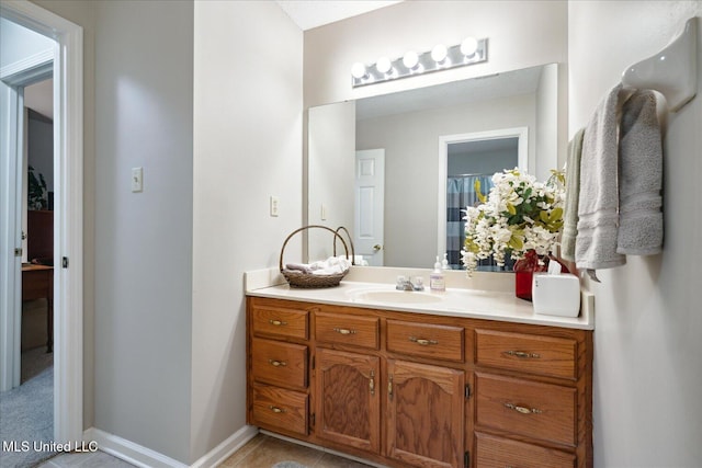 bathroom with vanity and tile patterned floors