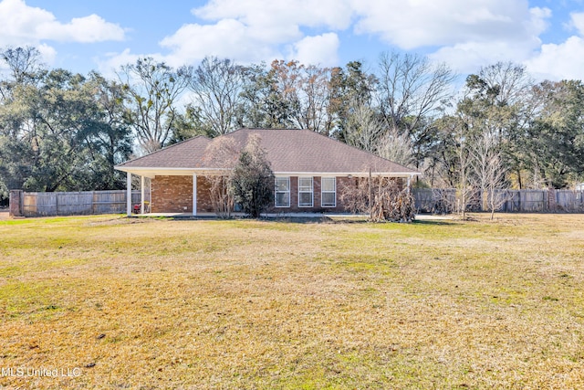 ranch-style home with a front lawn